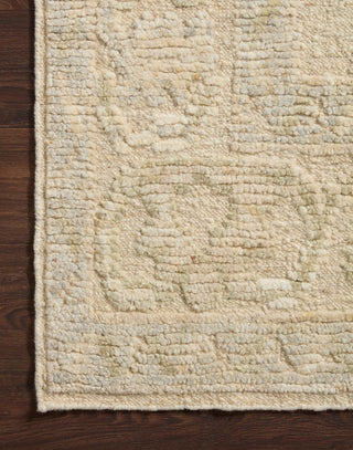 Hand Knotted Wool Rug with a raised texture with organic ivory and sage coloring.