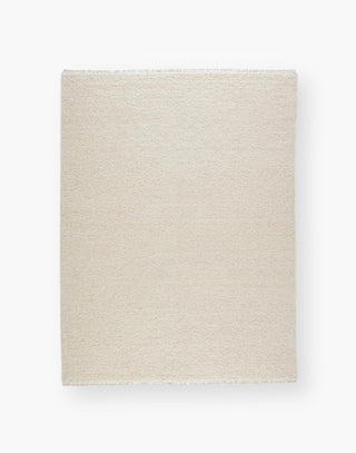 Wool rug with a light neutral cream palette and soft, textural soumak weave details.