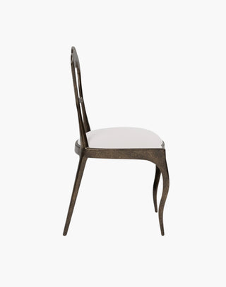 French inspired white upholstered dining chair with rustic bronze metal.