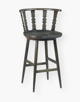 Counter stool with spindle detailing, inspired by 18th-century classics, made from hardwood solids in a warm black finish.