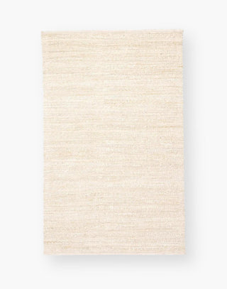Jute area rug with cotton backing and a rayon blend with creamy natural and bleached white colorway.