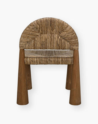 A stunning dining room chair with natural teak paired with seagrass.