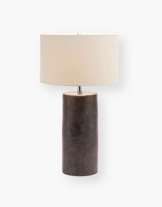 Hand glazed ceramic table lamp in matte black with a linen drum shade.