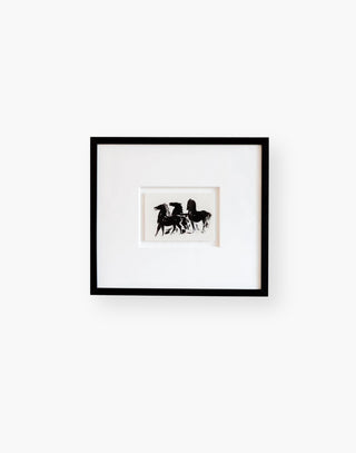 Ink drawing featuring three galloping horses