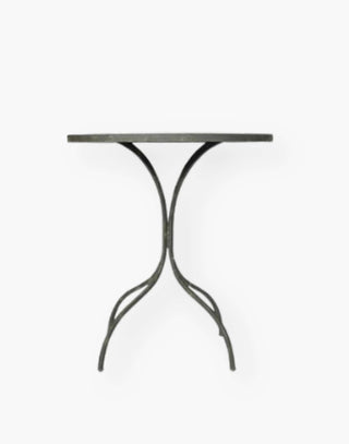 18th century French inspired guéridon with a honed metal top over four shaped metal legs.