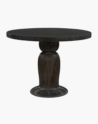 Detailed dining table with ribbing effect over the body and top edge with a hand rubbed black finish.