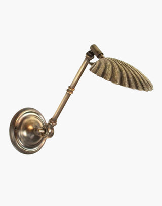  Distressed Oyster Shell Adjustable Wall Light in solid brass. Handcrafted with swivel and knuckle joint for versatile illumination. Ideal for reading and bedside use.