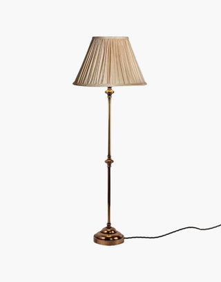 Distressed Finish with Natural Shade Provencal table lamps: simple, solid brass narrow lamps ideal for console or side tables.