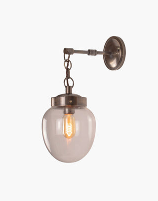 Distressed Finish with Clear Glass Charleston Wall Light: Solid brass mid-century style lighting. Suitable for outdoor use.