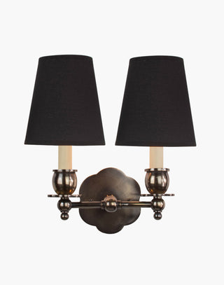 Distressed Finish with D6 Black Shade India Rose Sconces: Solid brass petal design. Versatile for contemporary or traditional settings.
