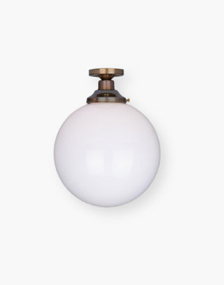 Semi-Flush Ceiling Light with an Opal Glass Shade in Antique Brass.