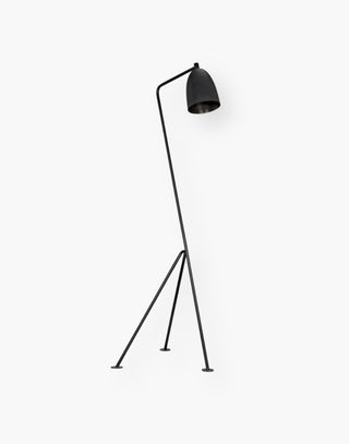 Industrial Steel Floor Lamp with a matte black finish on three pronged legs.