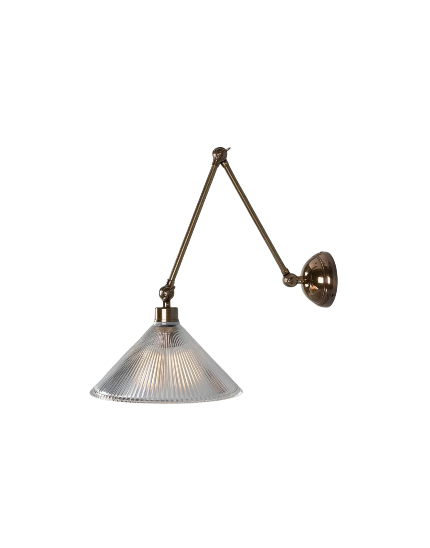 Adjustable brass wall sconce with articulated arm and ribbed prismatic glass shade for focused task lighting.