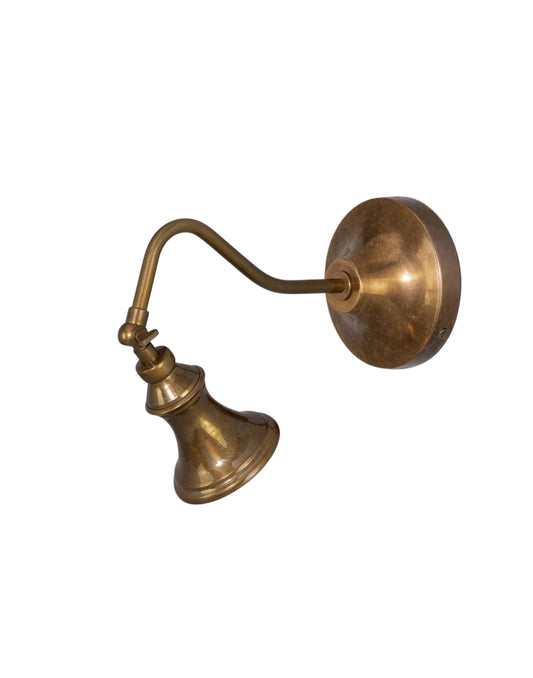 Wall Light adjustable brass spotlight with flared shade and curved arm, designed to highlight artwork, architectural details, or accent lighting in dry interior spaces.