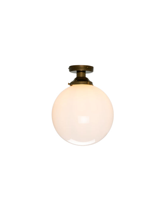 Opal glass globe ceiling light with brass fittings, flush mount, ambient lighting for hallways, kitchens, and bedrooms.