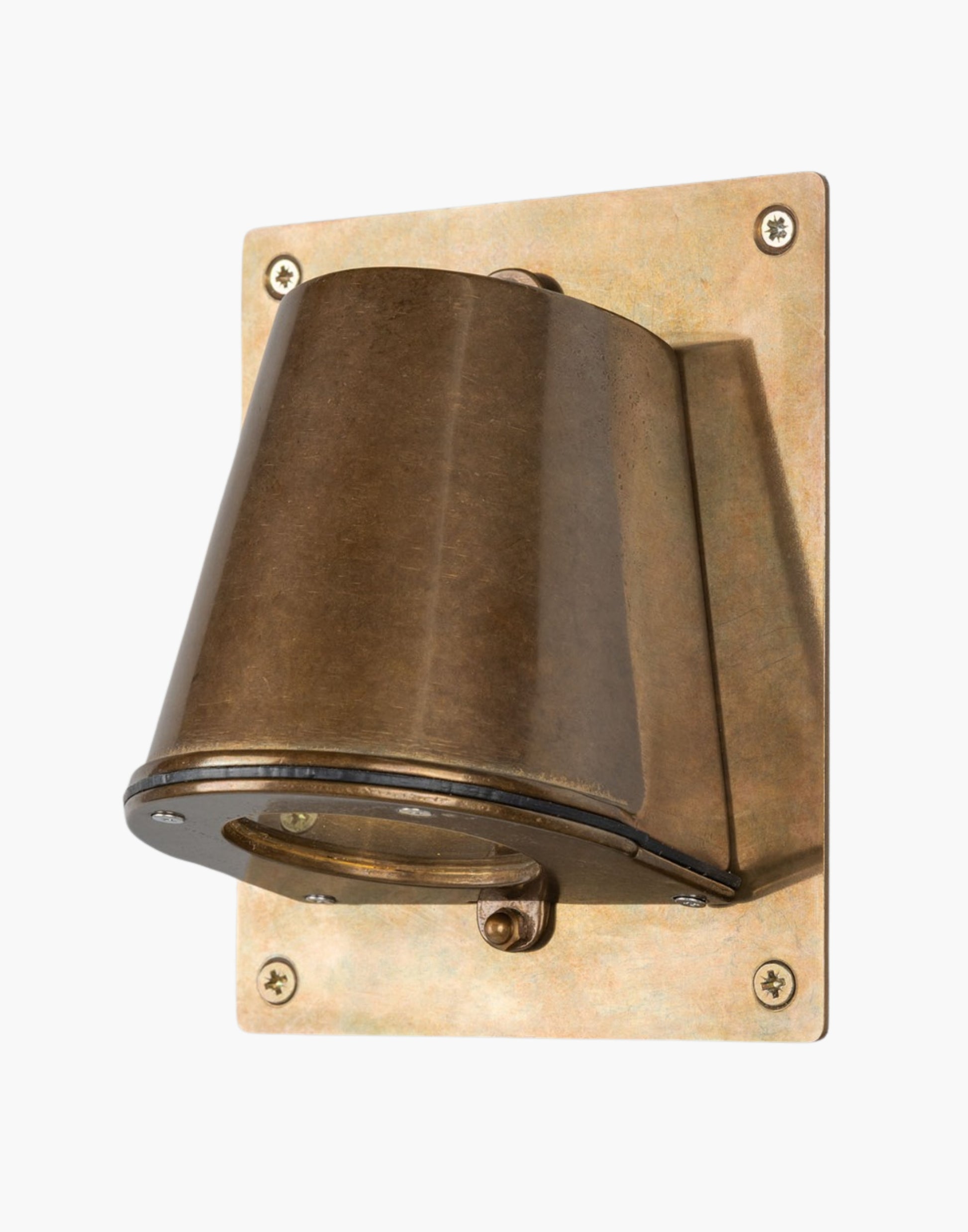 Outdoor brass wall spotlight with glass lens and compact rectangular back plate, IP54 rated, ADA compliant, designed for focused exterior lighting.