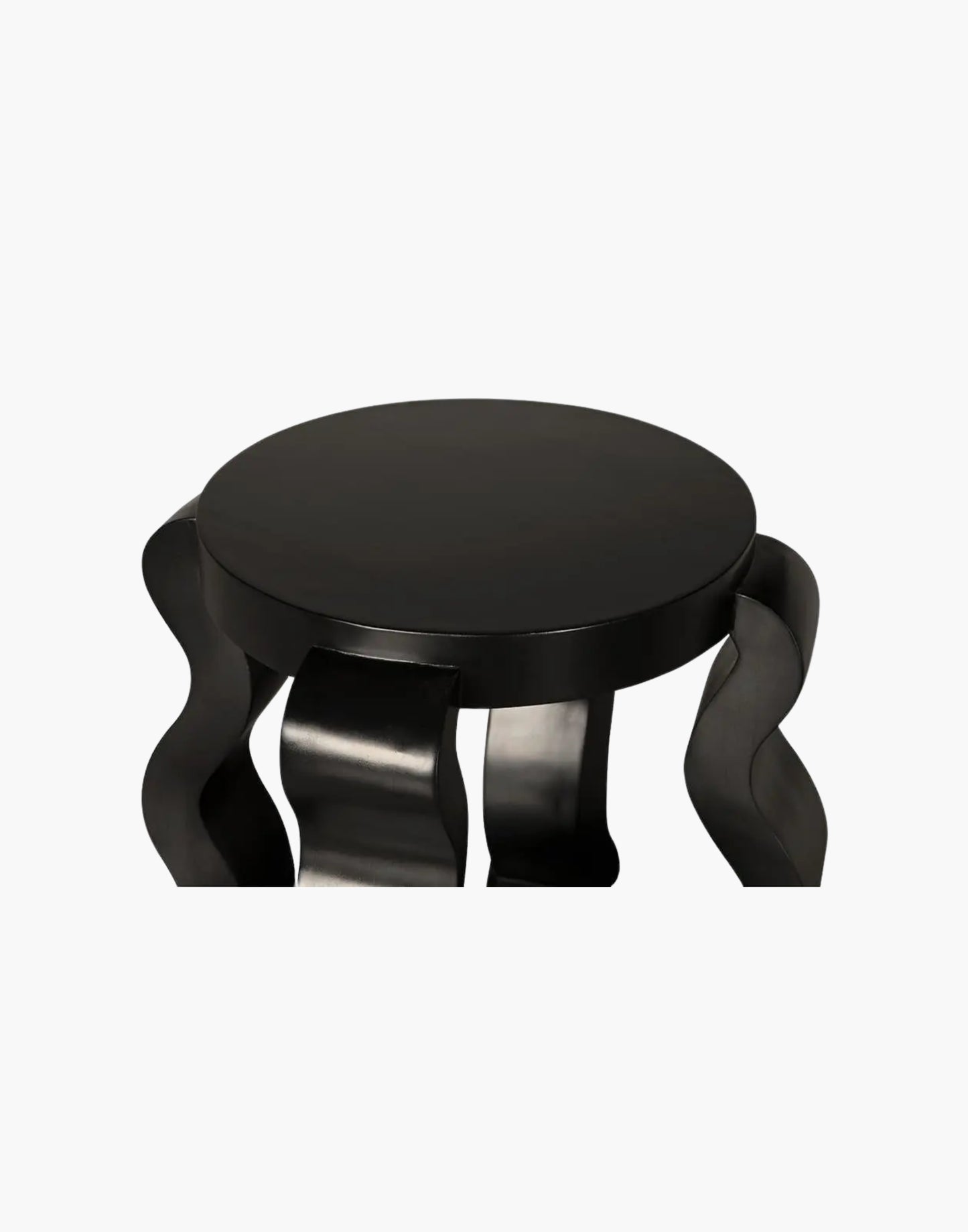 Round black side table with sculptural ribbon legs and open shelf in hand-rubbed black finish.