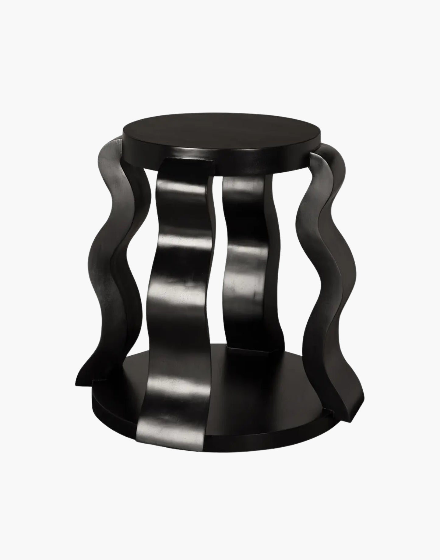 Round black side table with sculptural ribbon legs and open shelf in hand-rubbed black finish.