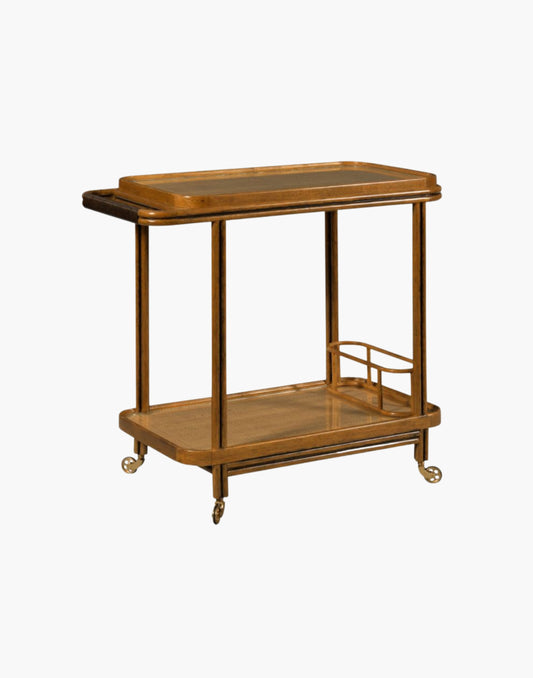 Bar cart with woven cane frame, tempered glass shelves, bottle holder, and brass casters in hazelnut finish.