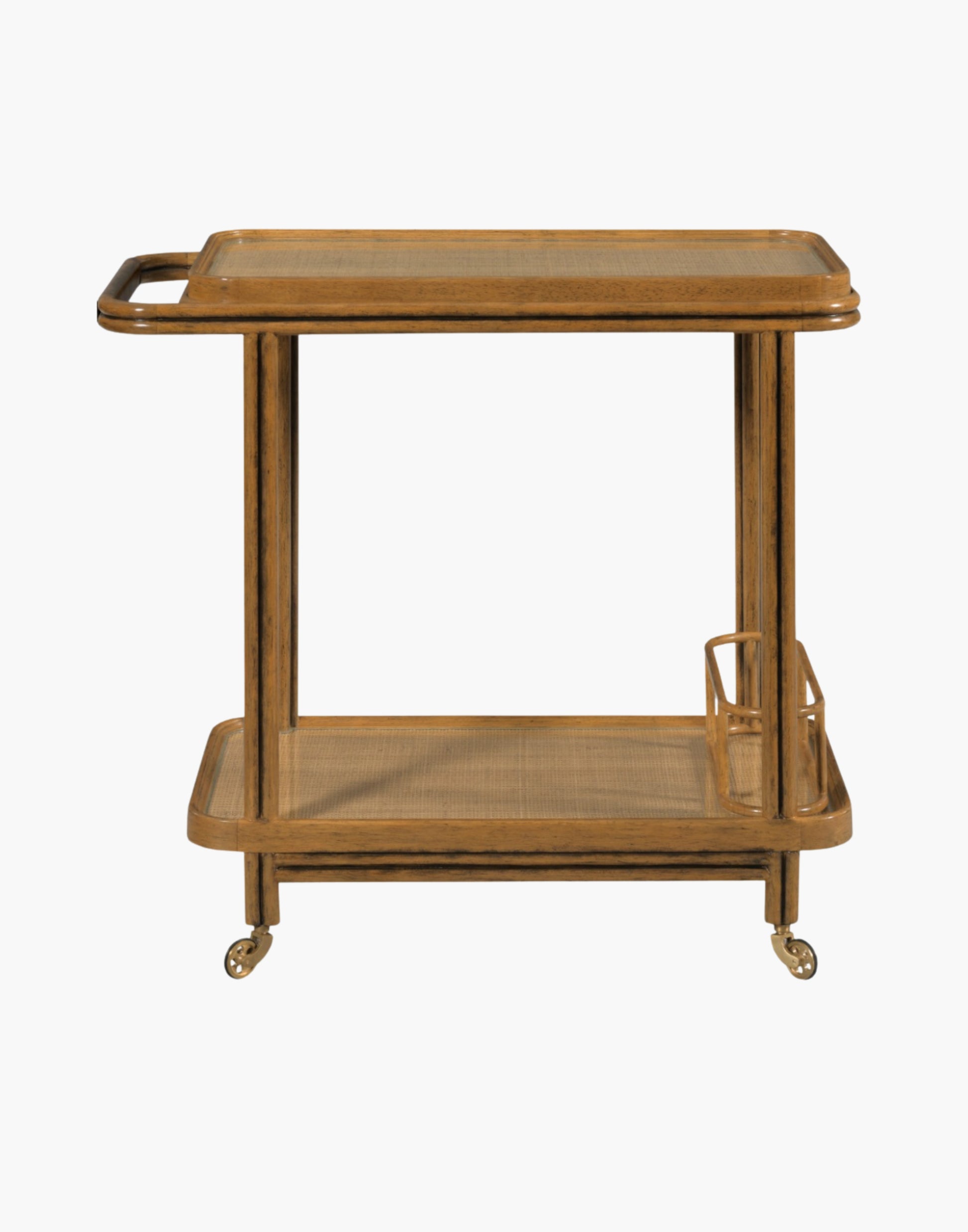 Bar cart with woven cane frame, tempered glass shelves, bottle holder, and brass casters in hazelnut finish.