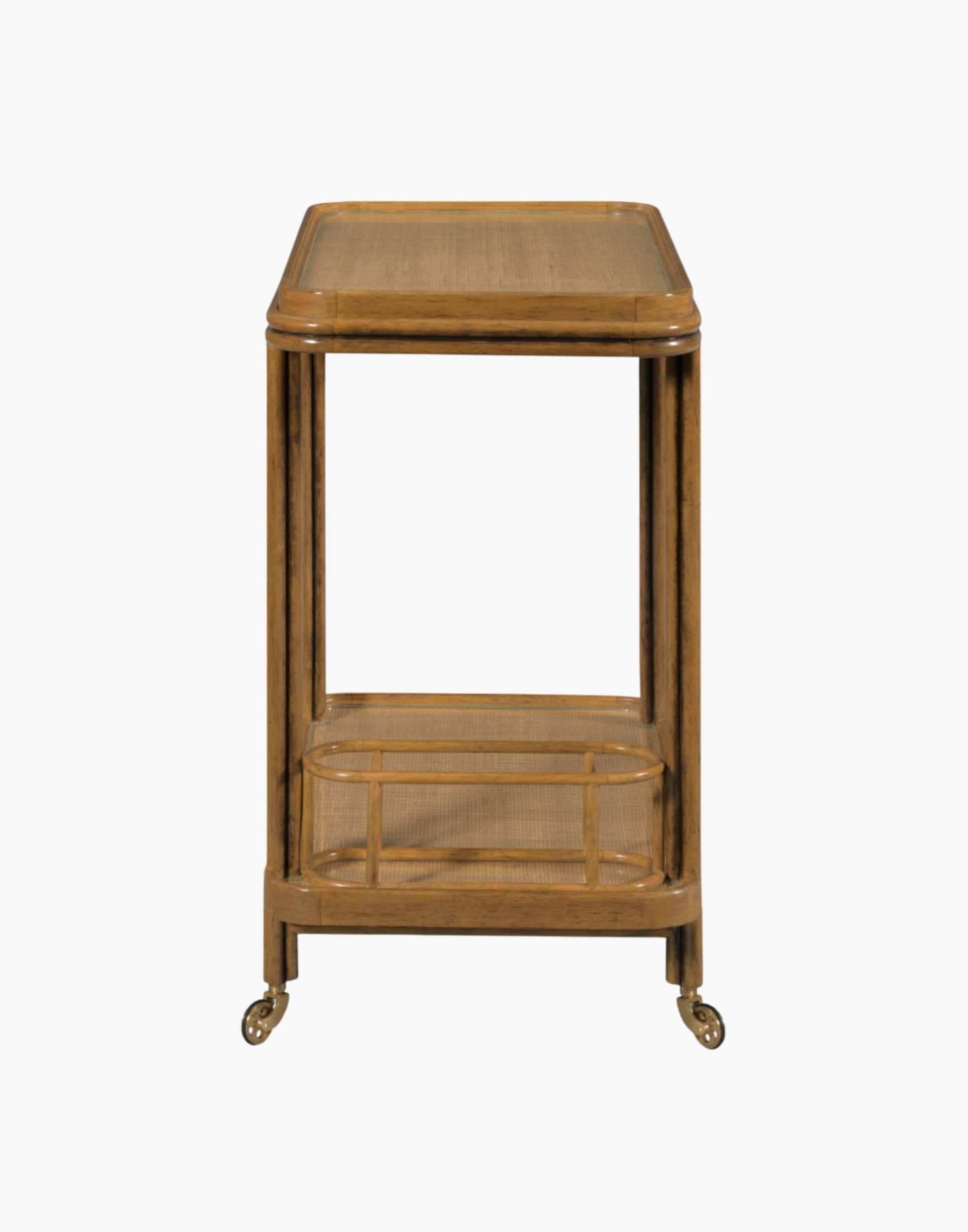 Bar cart with woven cane frame, tempered glass shelves, bottle holder, and brass casters in hazelnut finish.