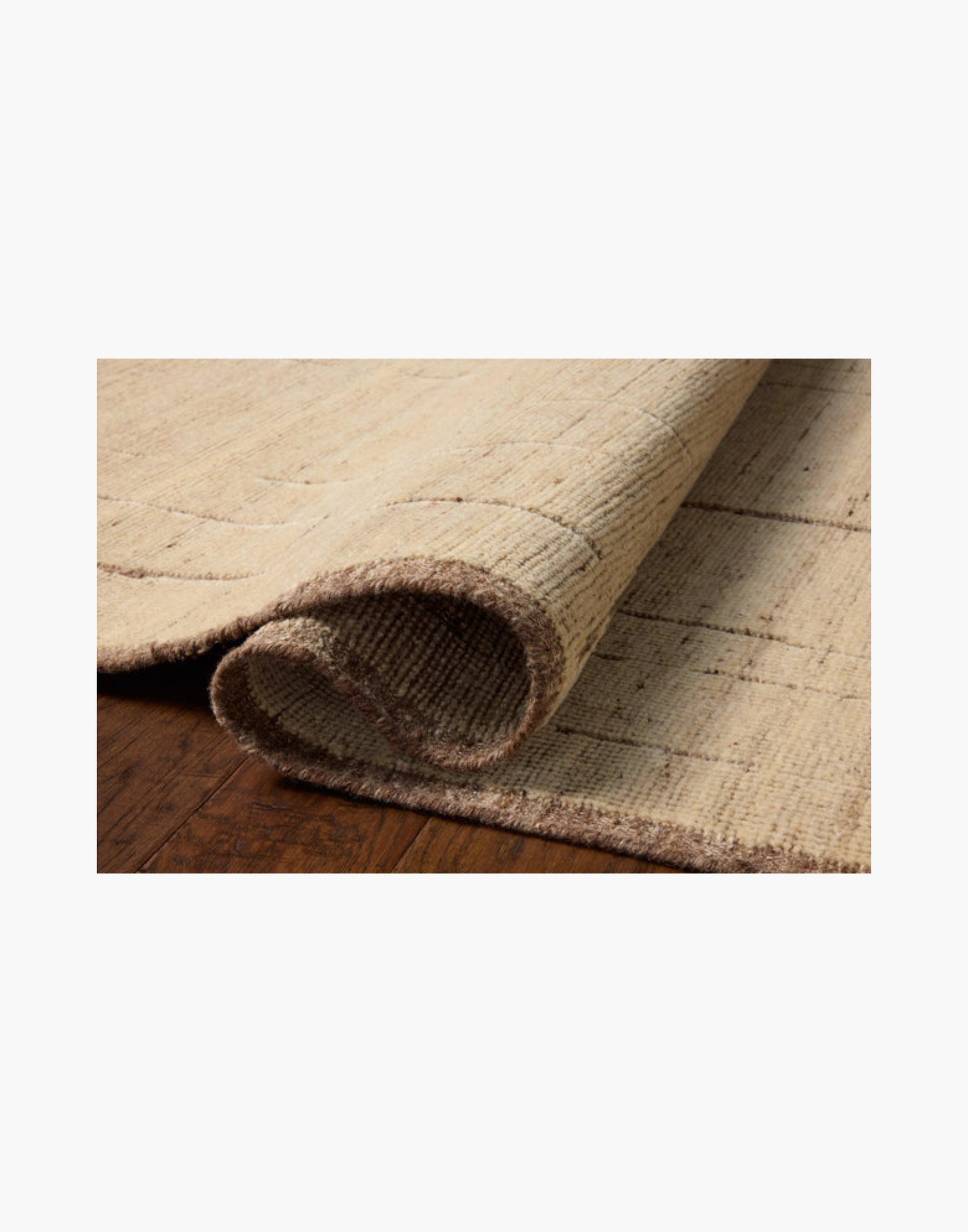Hand-knotted wool and cotton rug in brown and antique ivory tones