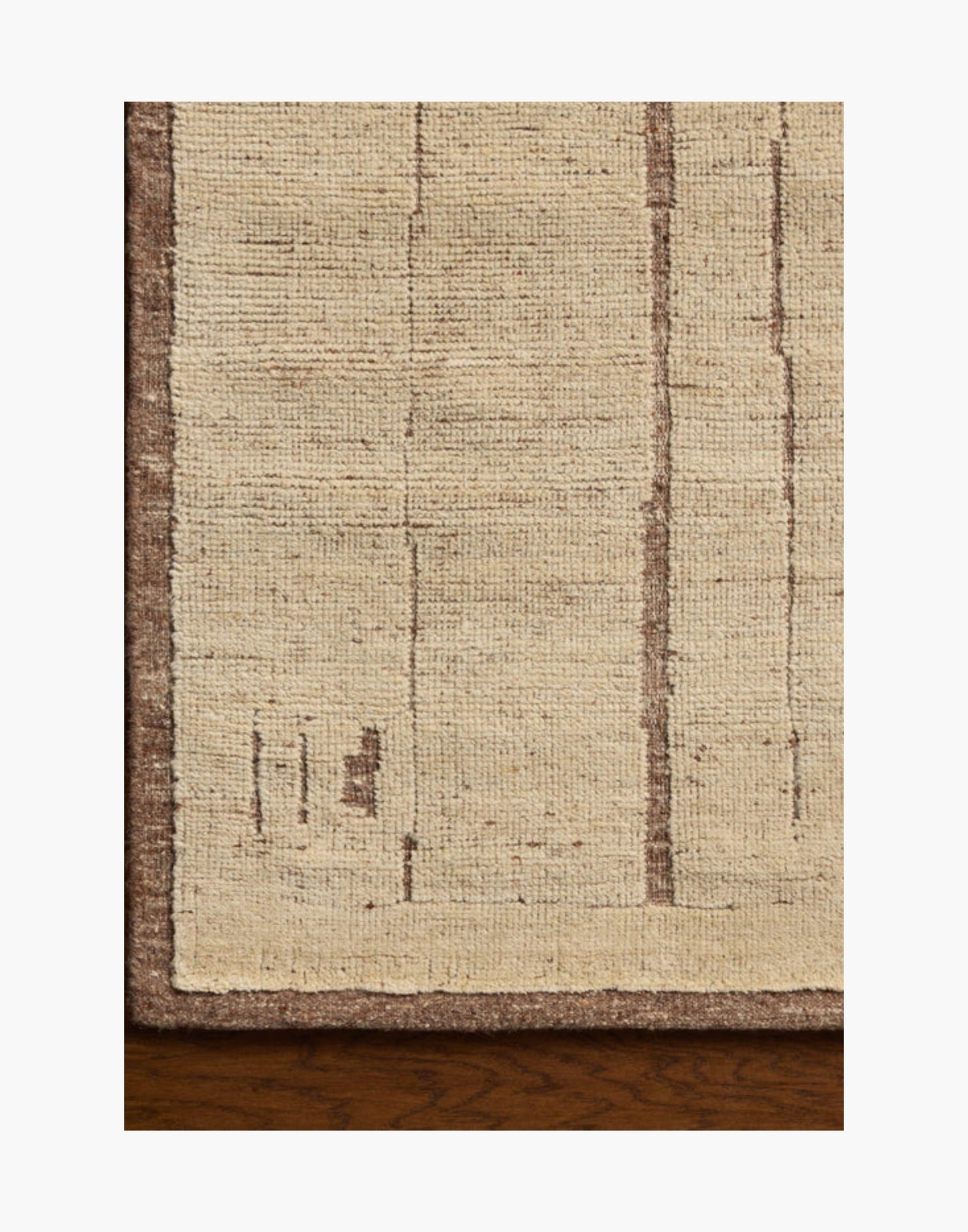 Hand-knotted wool and cotton rug in brown and antique ivory tones