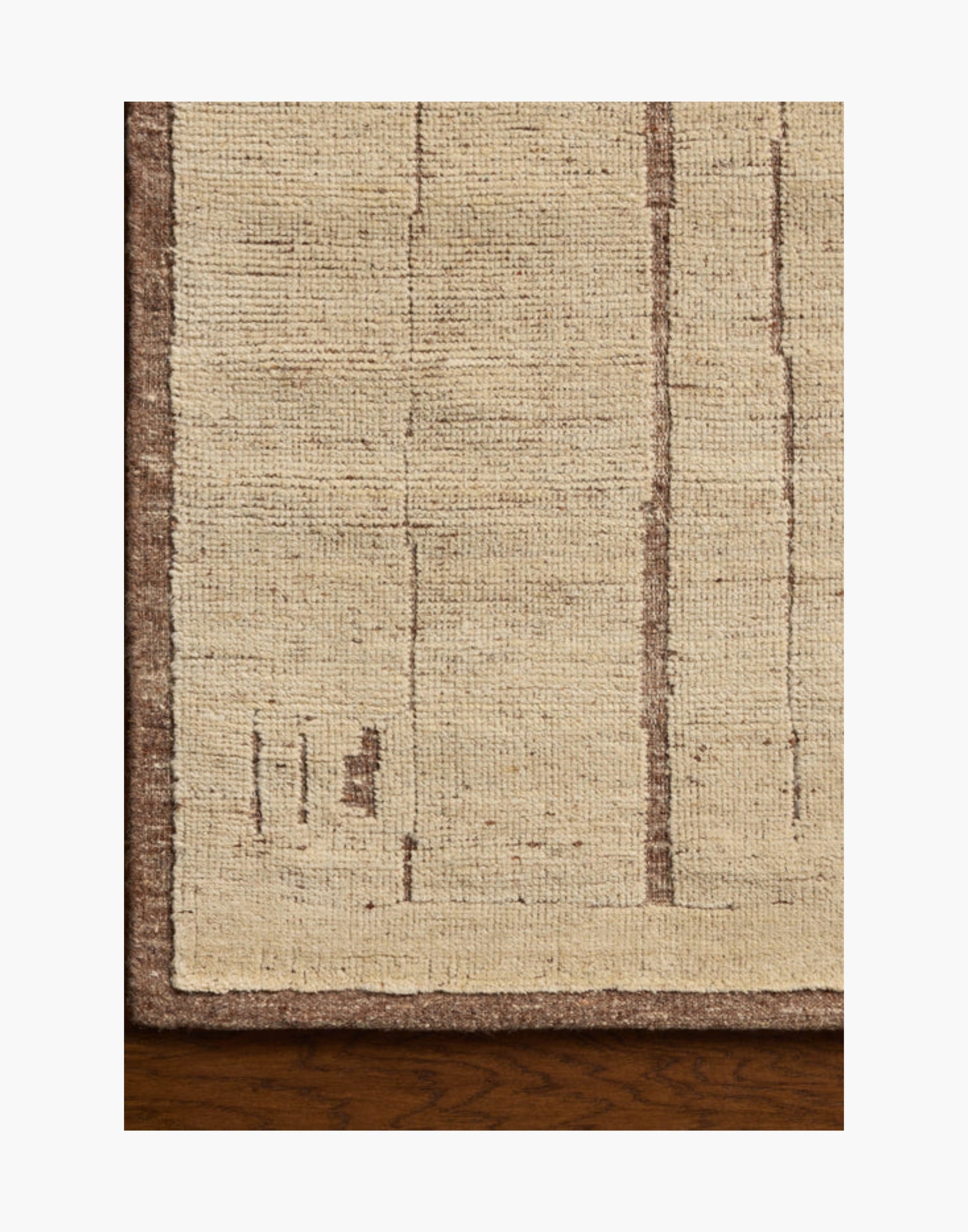 Hand-knotted wool and cotton rug in brown and antique ivory tones