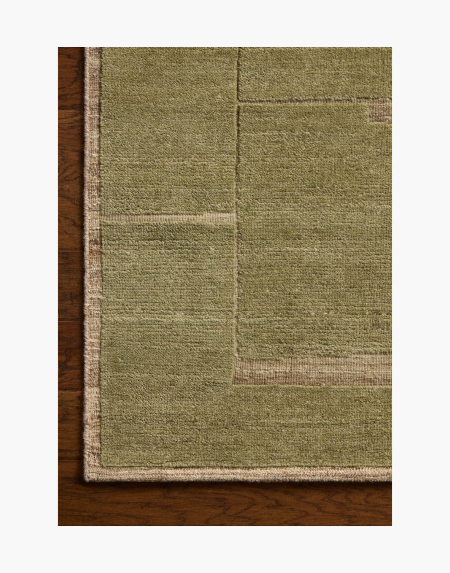 Hand-knotted wool and cotton rug in natural and moss tones