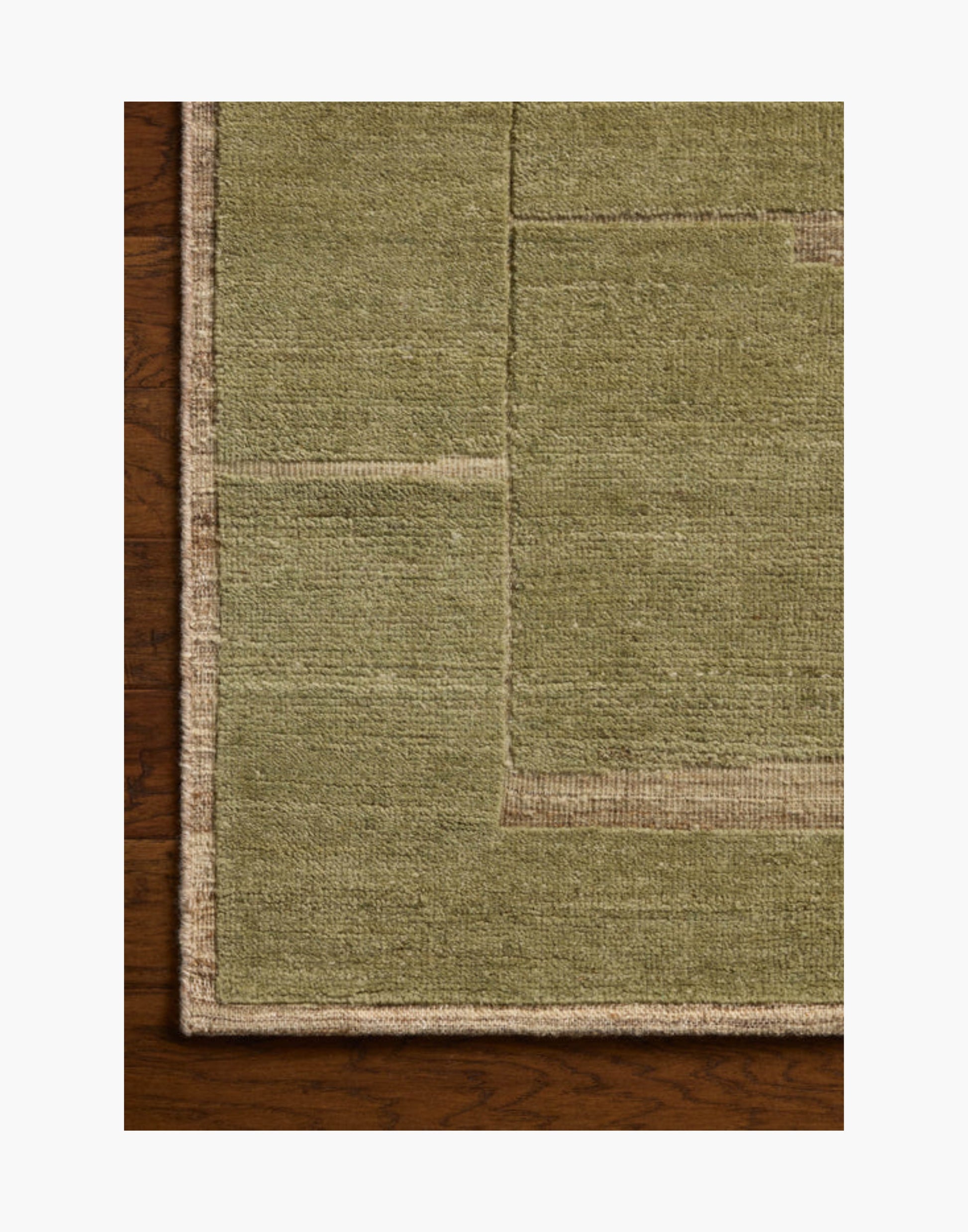 Hand-knotted wool and cotton rug in natural and moss tones