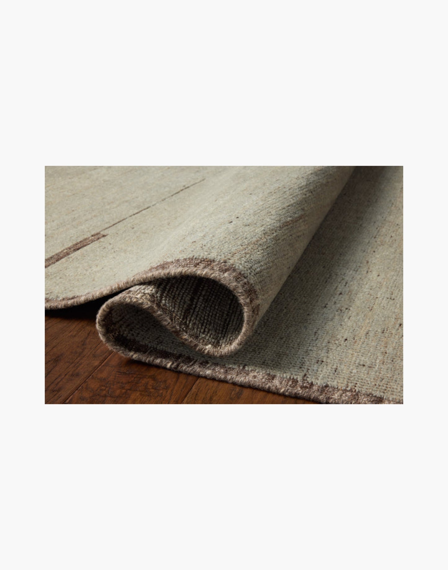 Hand-knotted wool and cotton rug in espresso and mist tones