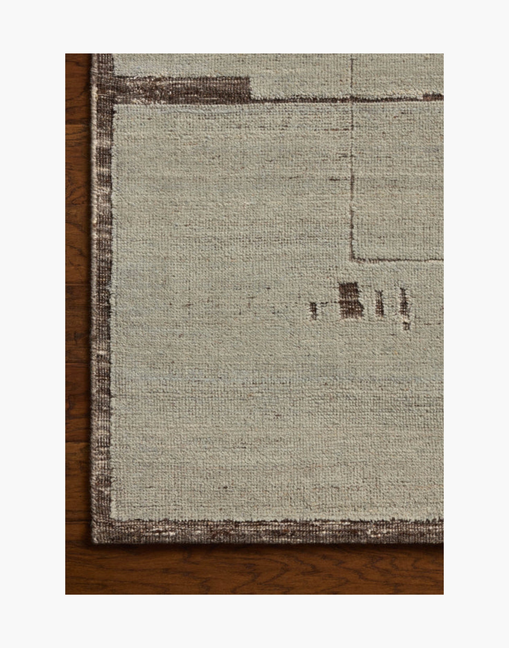 Hand-knotted wool and cotton rug in espresso and mist tones