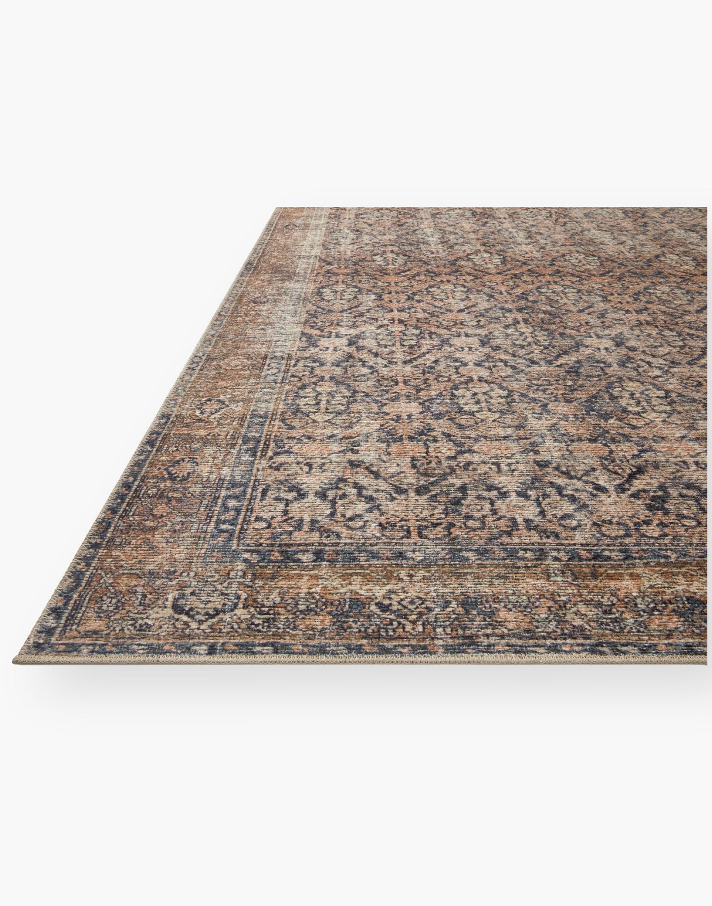 Ink and Salmon colored rug with a well-worn antique look.