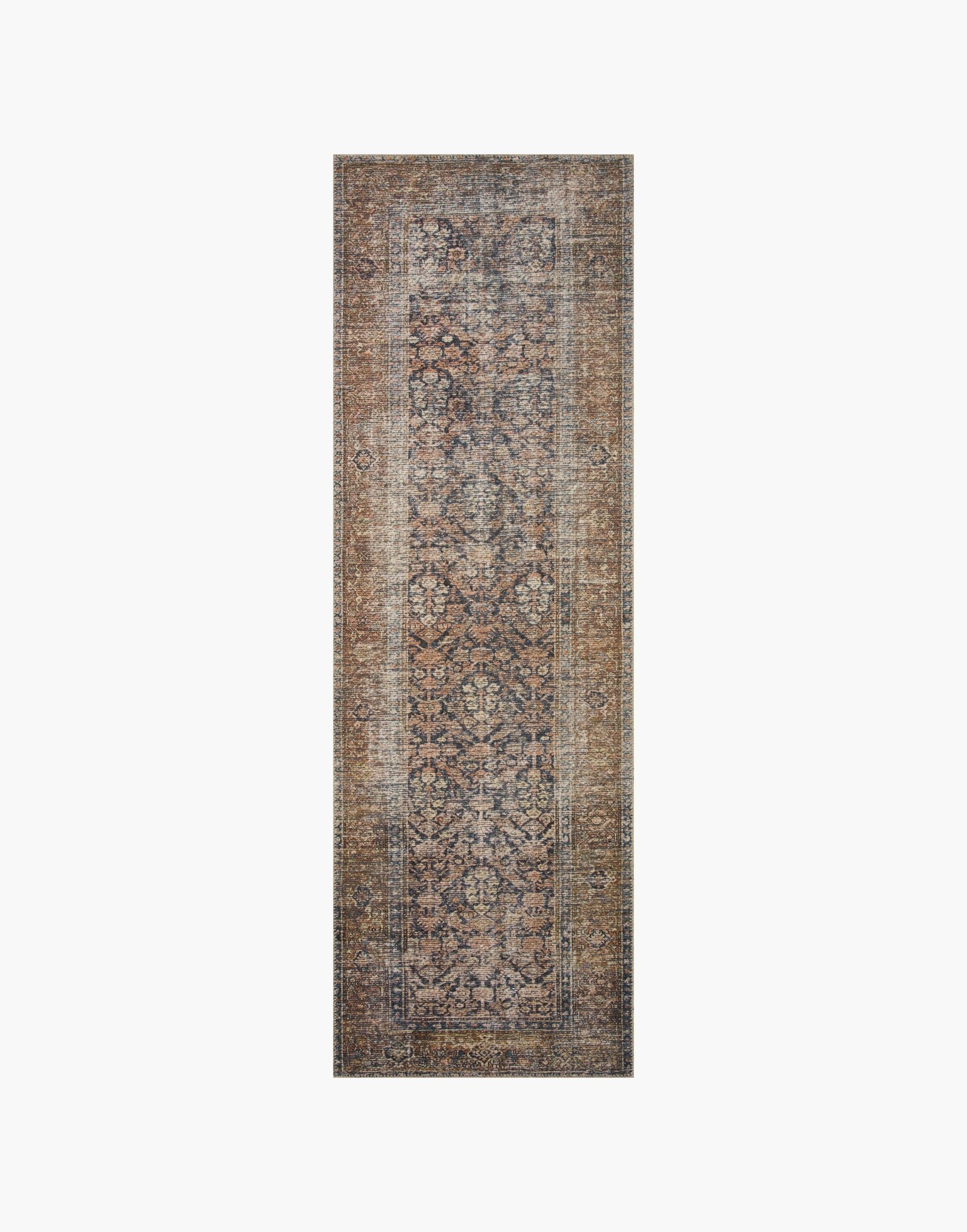 Ink and Salmon colored rug with a well-worn antique look.