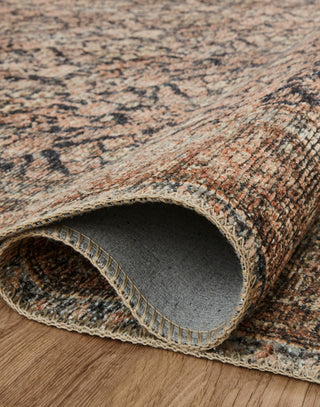 Ink and Salmon colored rug with a well-worn antique look.