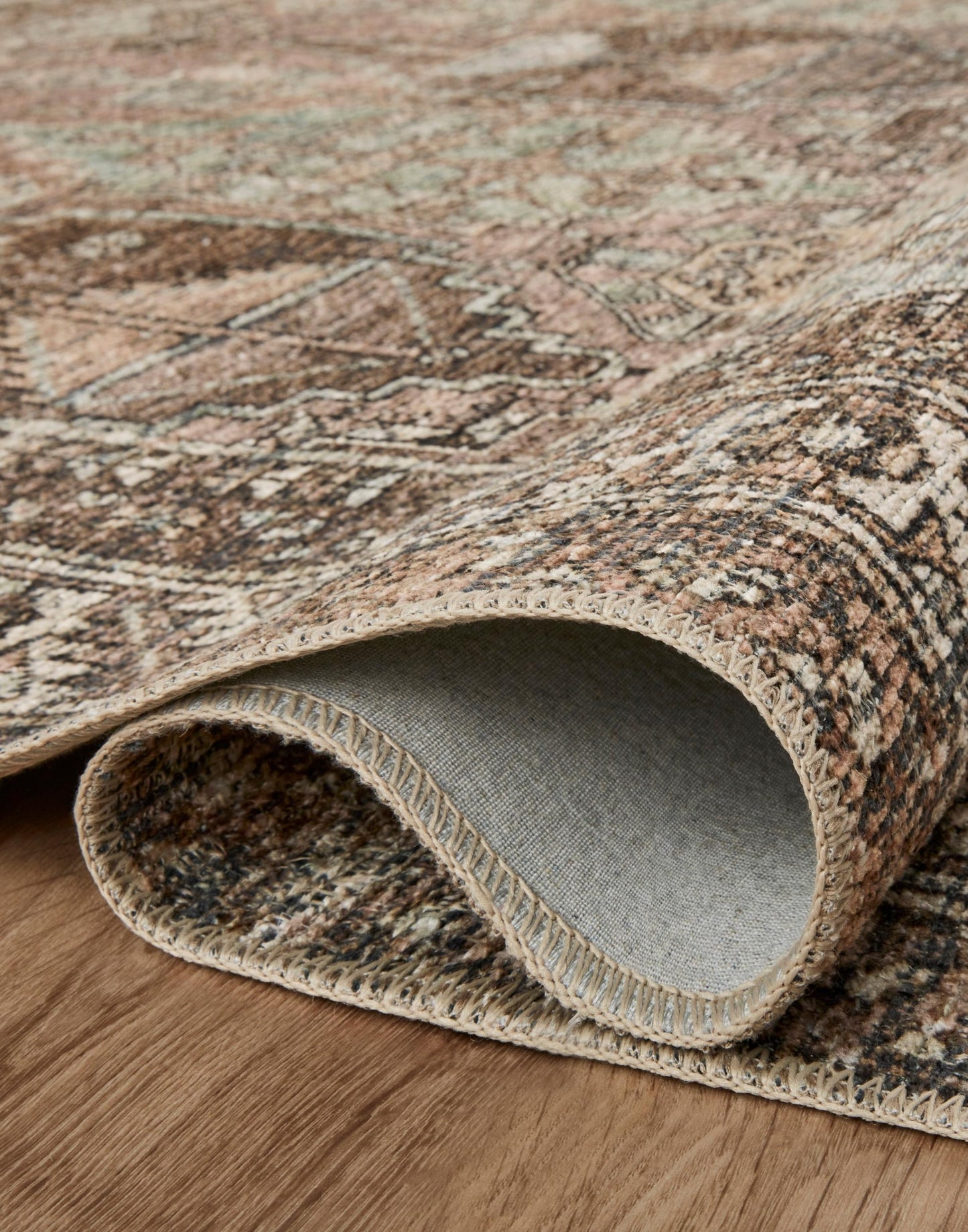 Power Loomed Rug with Clay and Sage Coloring.