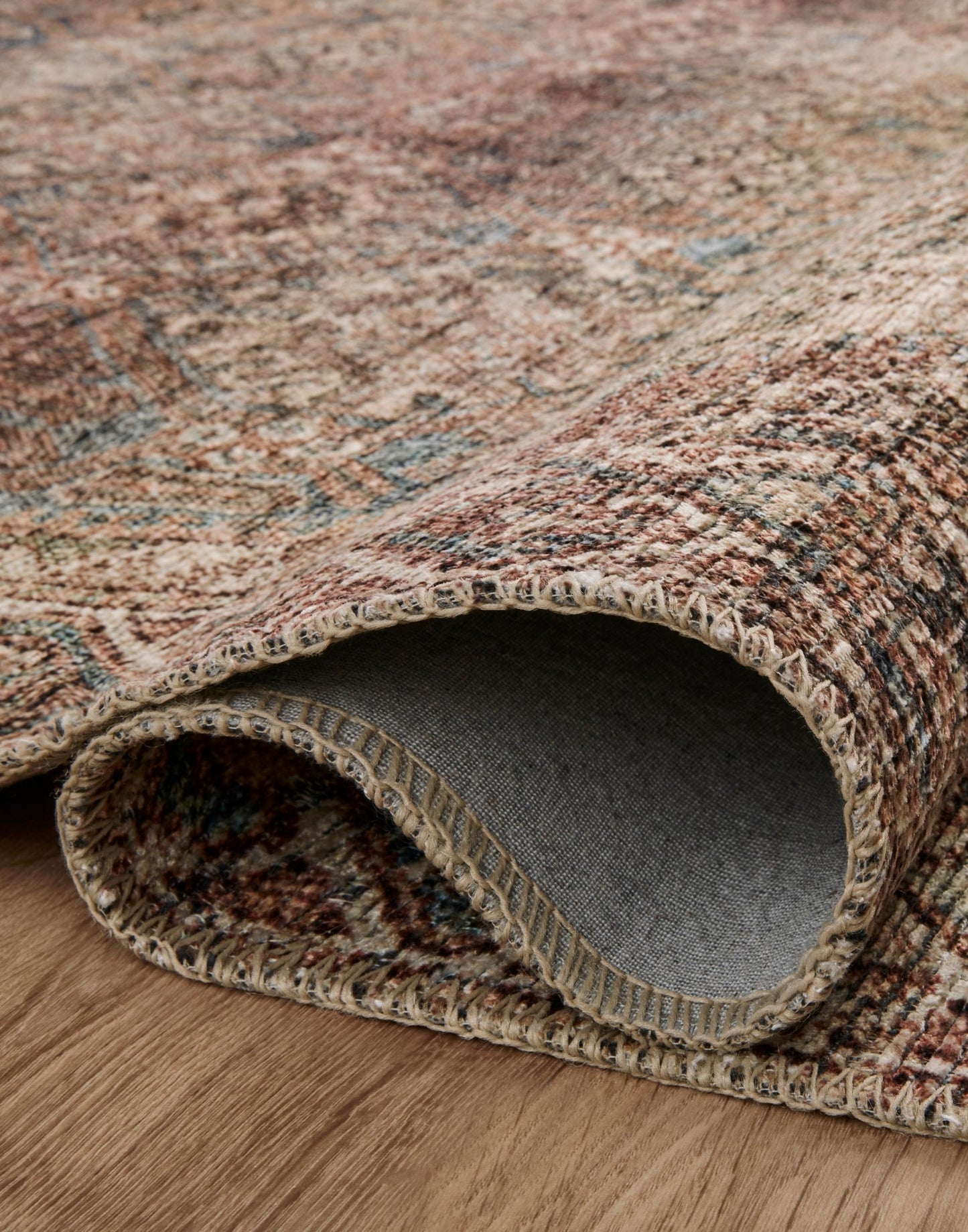 Amber Lewis x Loloi Billie Collection rug with distressed antique-inspired pattern and rich colo