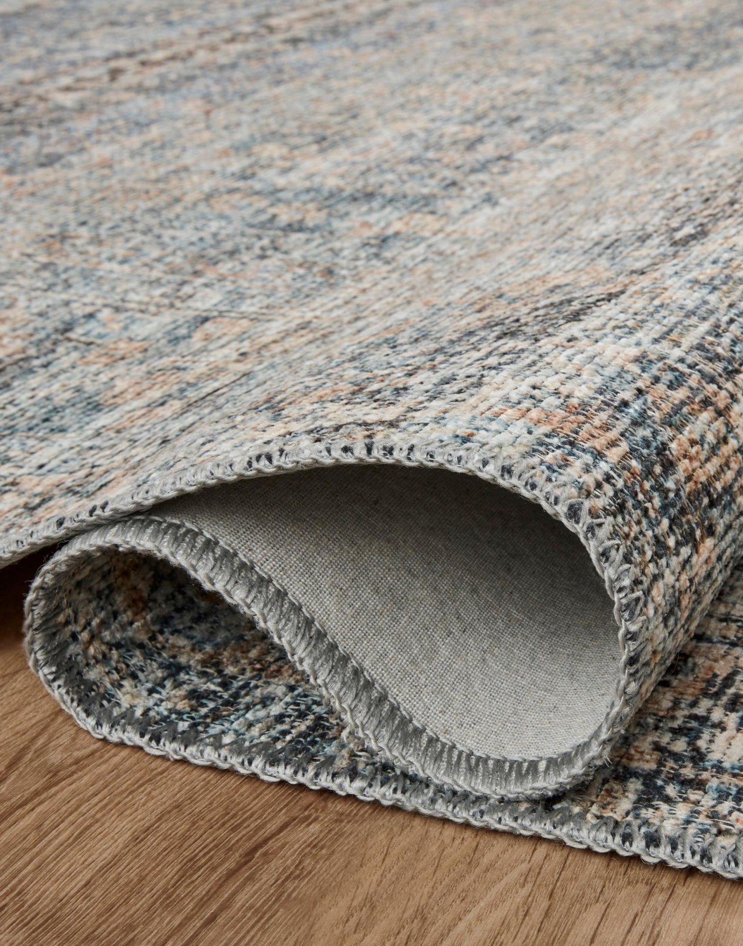 Power Loomed Rug with Denim and Blush Colors.
