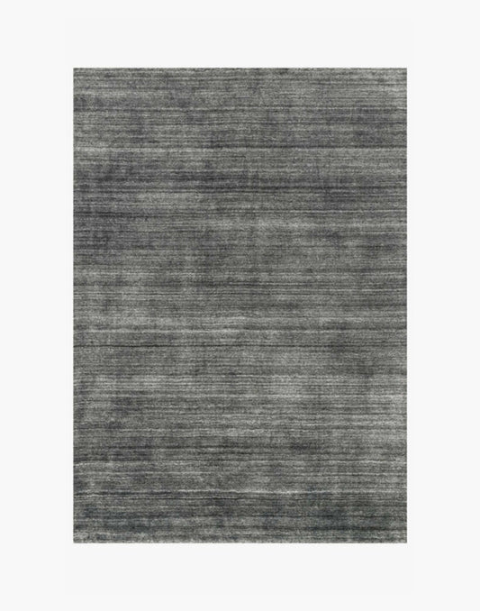 Hand-loomed charcoal rug with rayon and wool pile in rich dark tones