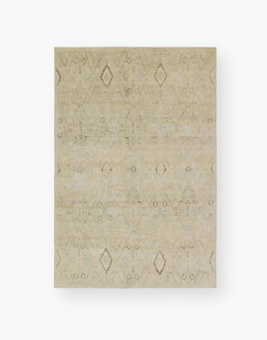 Power loomed area rug with a trellis pattern, short fringe and geometric details in light blue, pastel green, yellow, navy, and cream colorway.