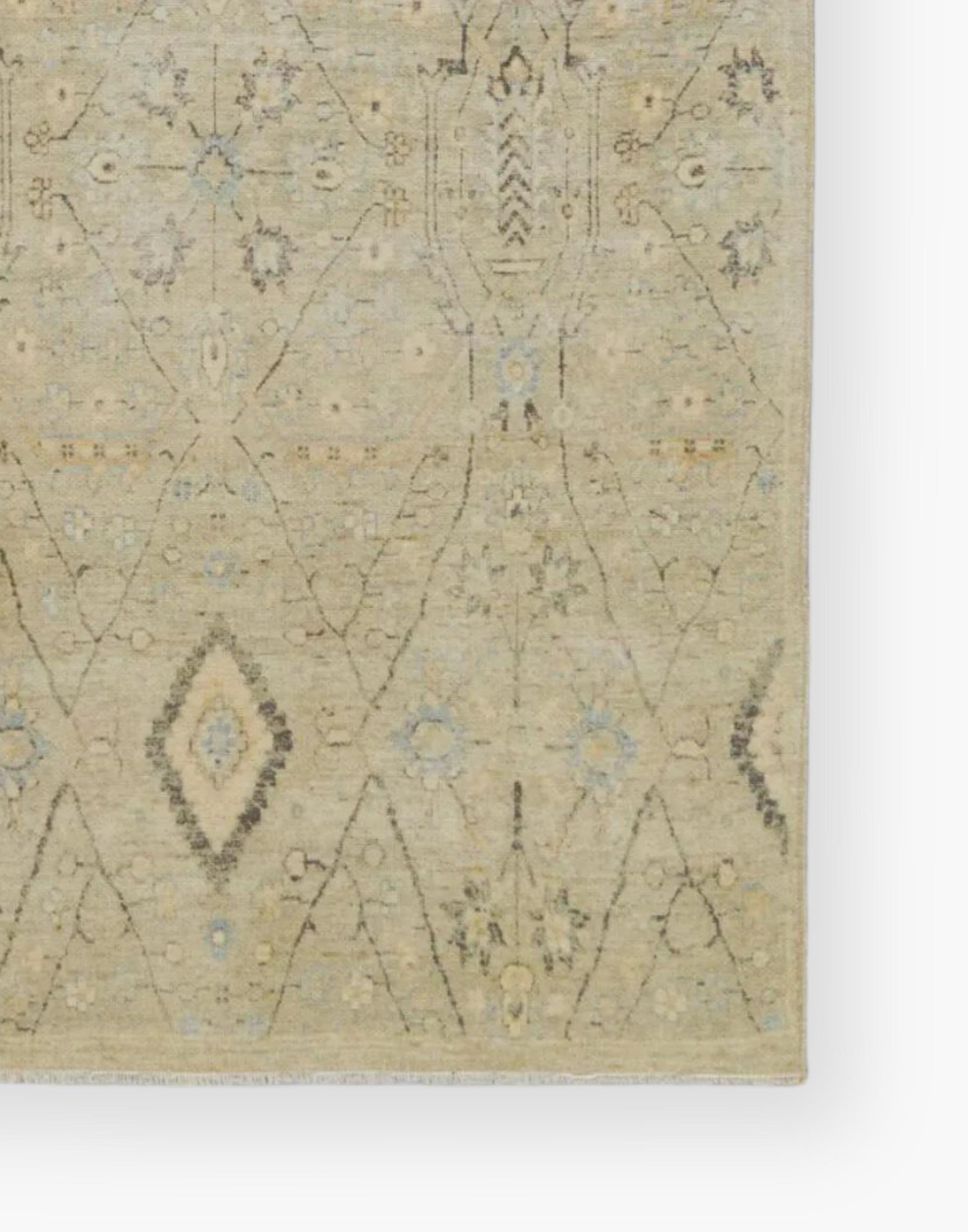Power loomed area rug with a trellis pattern, short fringe and geometric details in light blue, pastel green, yellow, navy, and cream colorway.