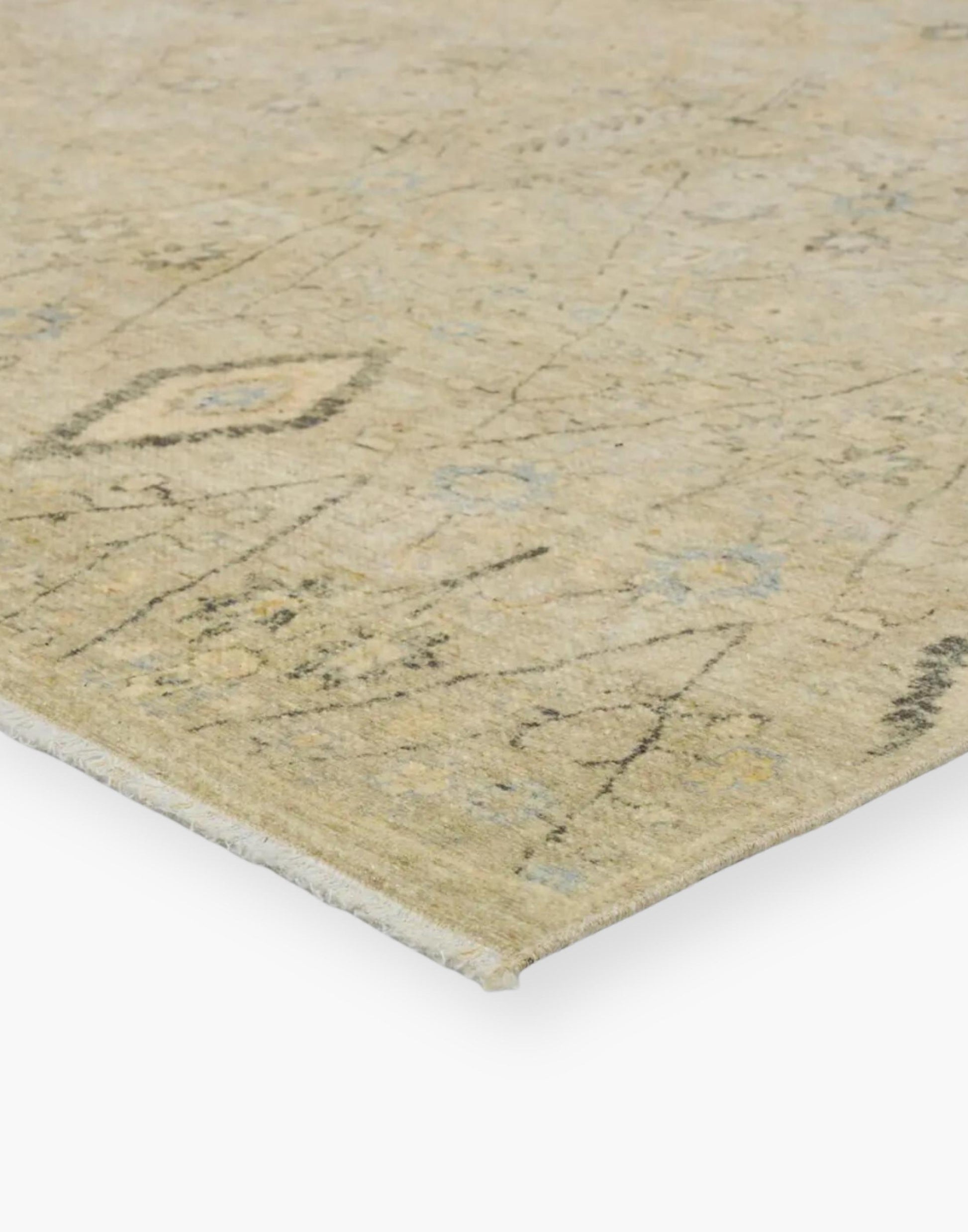 Power loomed area rug with a trellis pattern, short fringe and geometric details in light blue, pastel green, yellow, navy, and cream colorway.