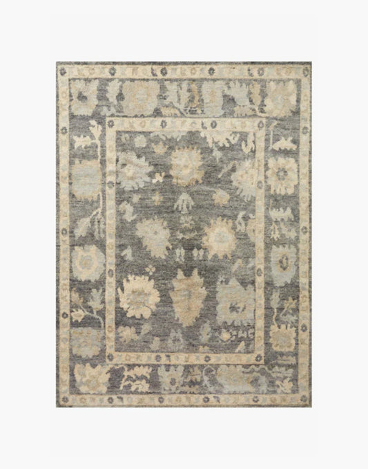 Hand-knotted wool rug in midnight and antique ivory tones