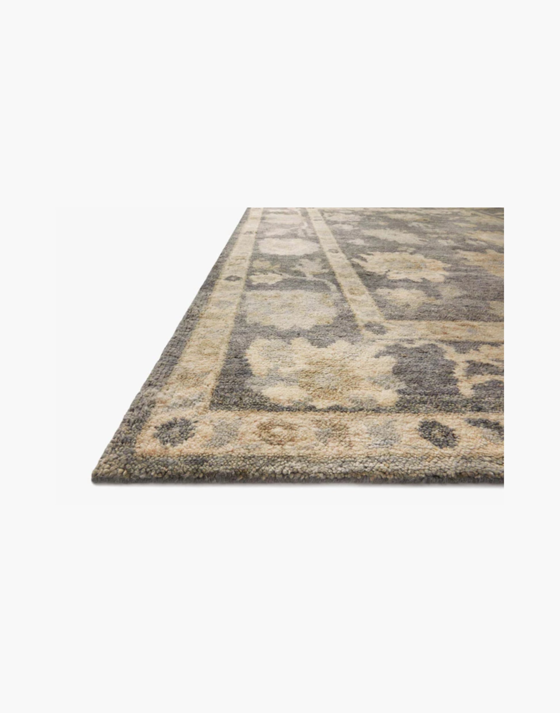 Hand-knotted wool rug in midnight and antique ivory tones
