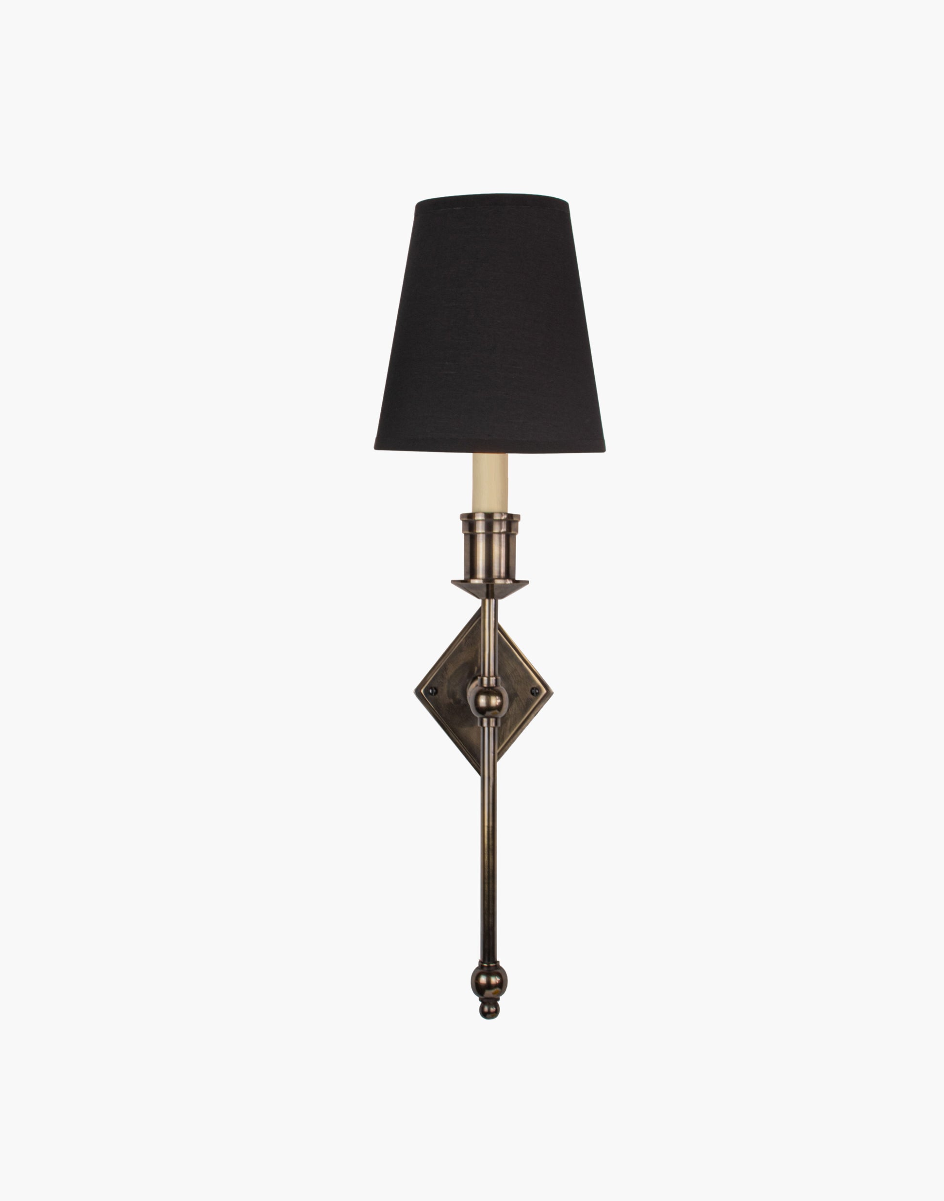 Wall sconce in cast and machined brass with diamond-shaped scalloped backplate and optional shade.