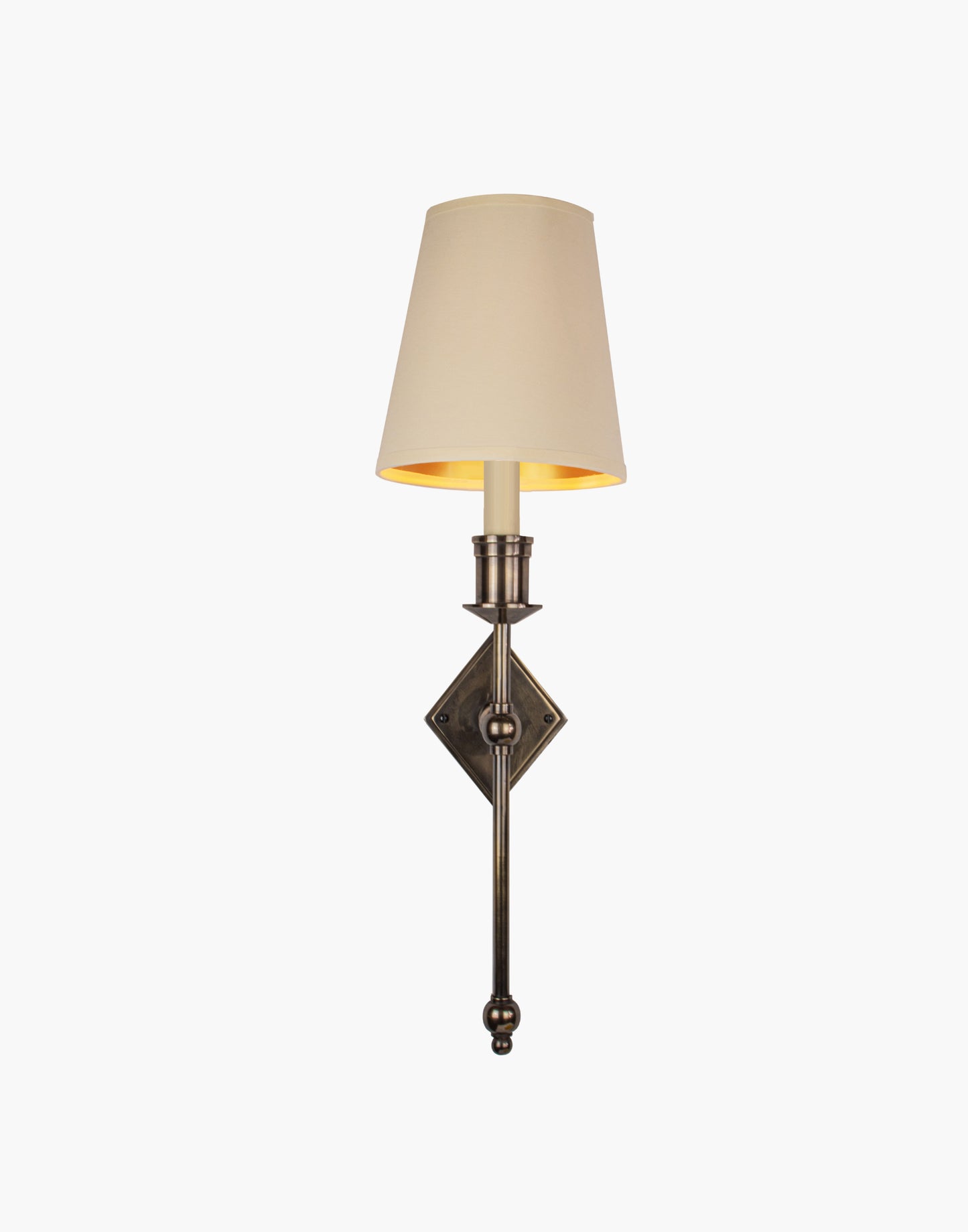 Wall sconce in cast and machined brass with diamond-shaped scalloped backplate and optional shade.