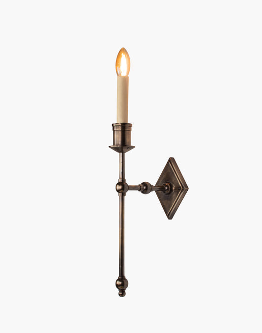 Wall sconce in cast and machined brass with diamond-shaped scalloped backplate and optional shade.