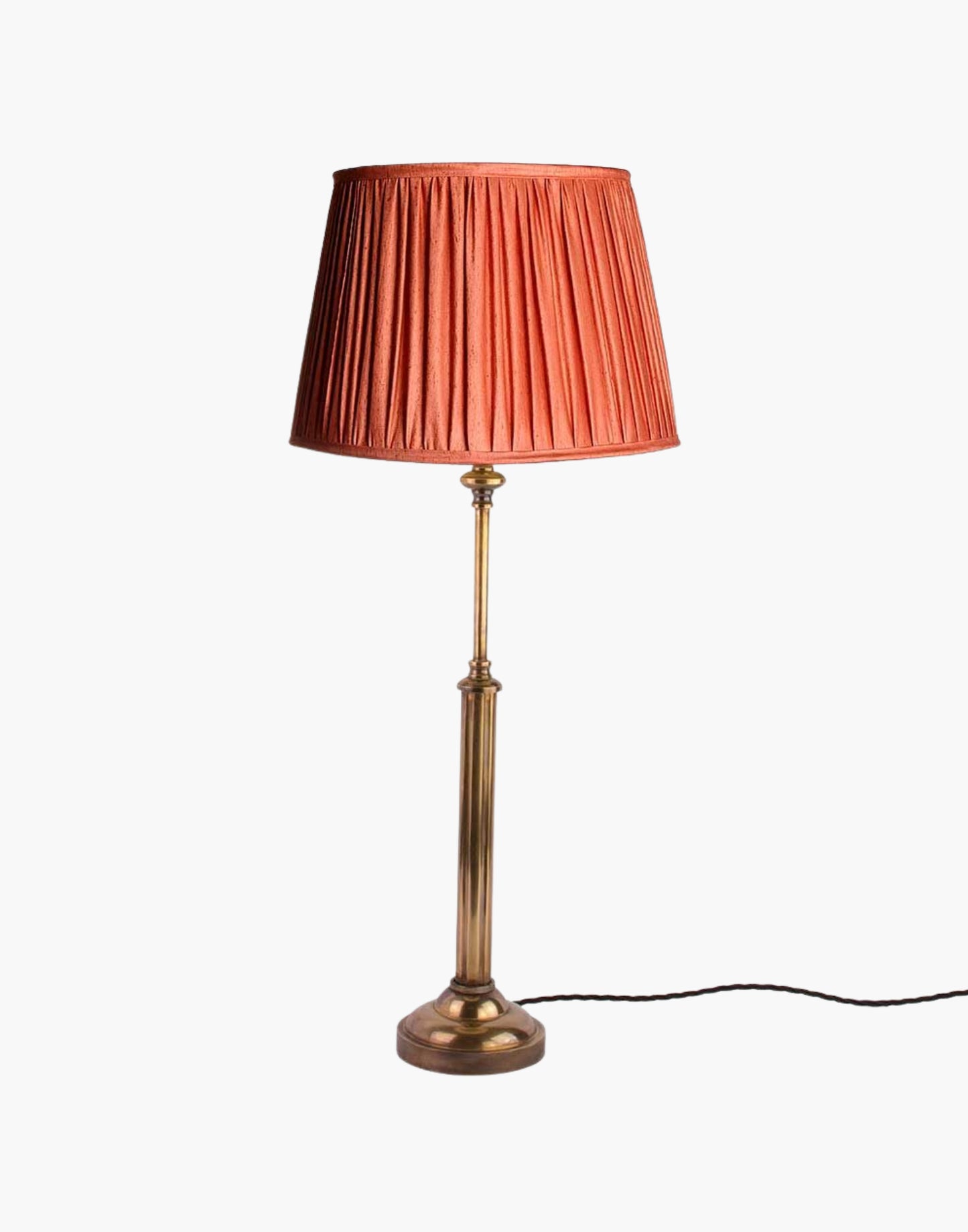 Brass table lamp with fluted stem and cast ball detail, colonial-style table lamp available with or without shade.