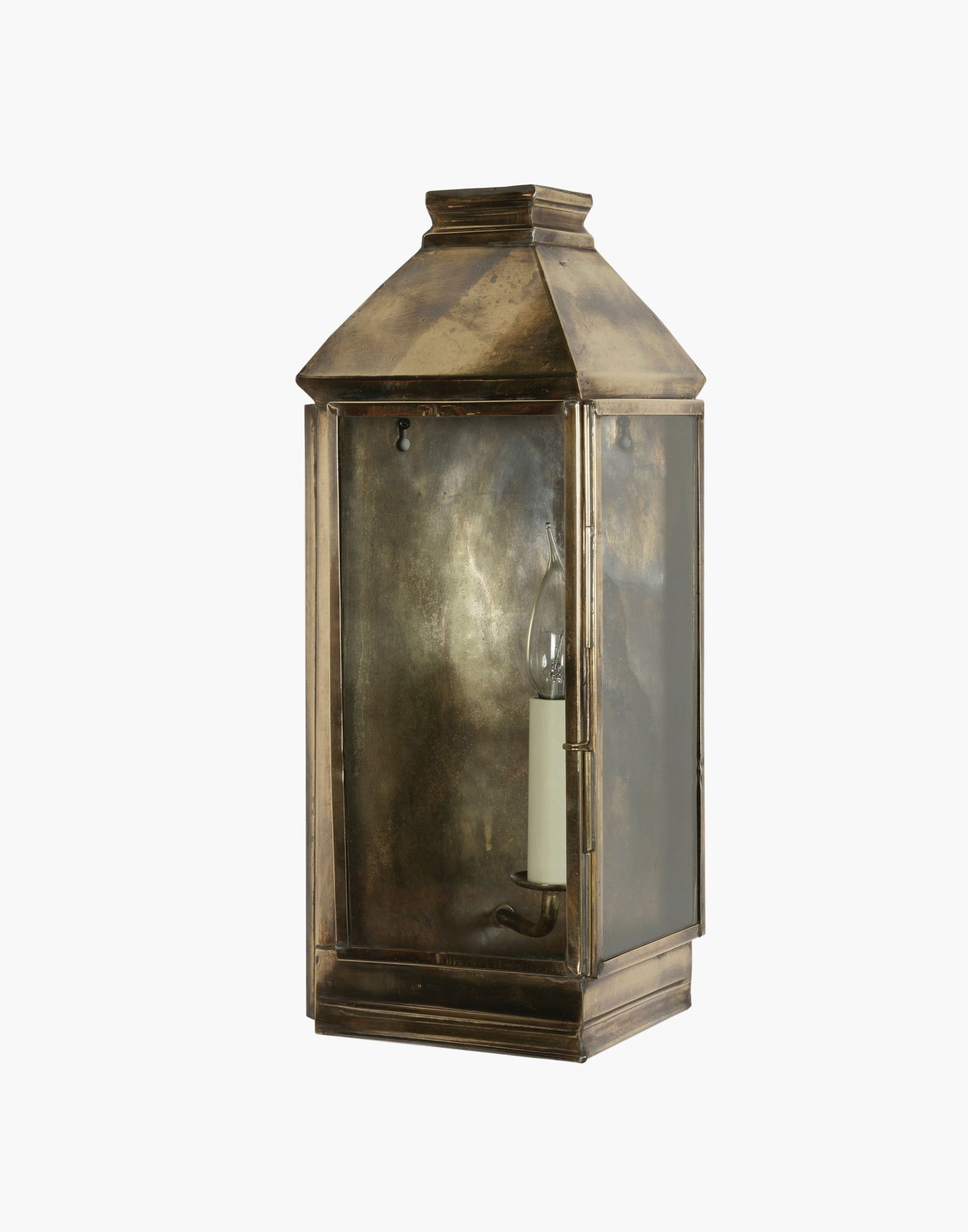 Wall Lantern in solid brass featuring a classic three sided French lantern design, wet rated for outdoor walls, porches, and entryways.