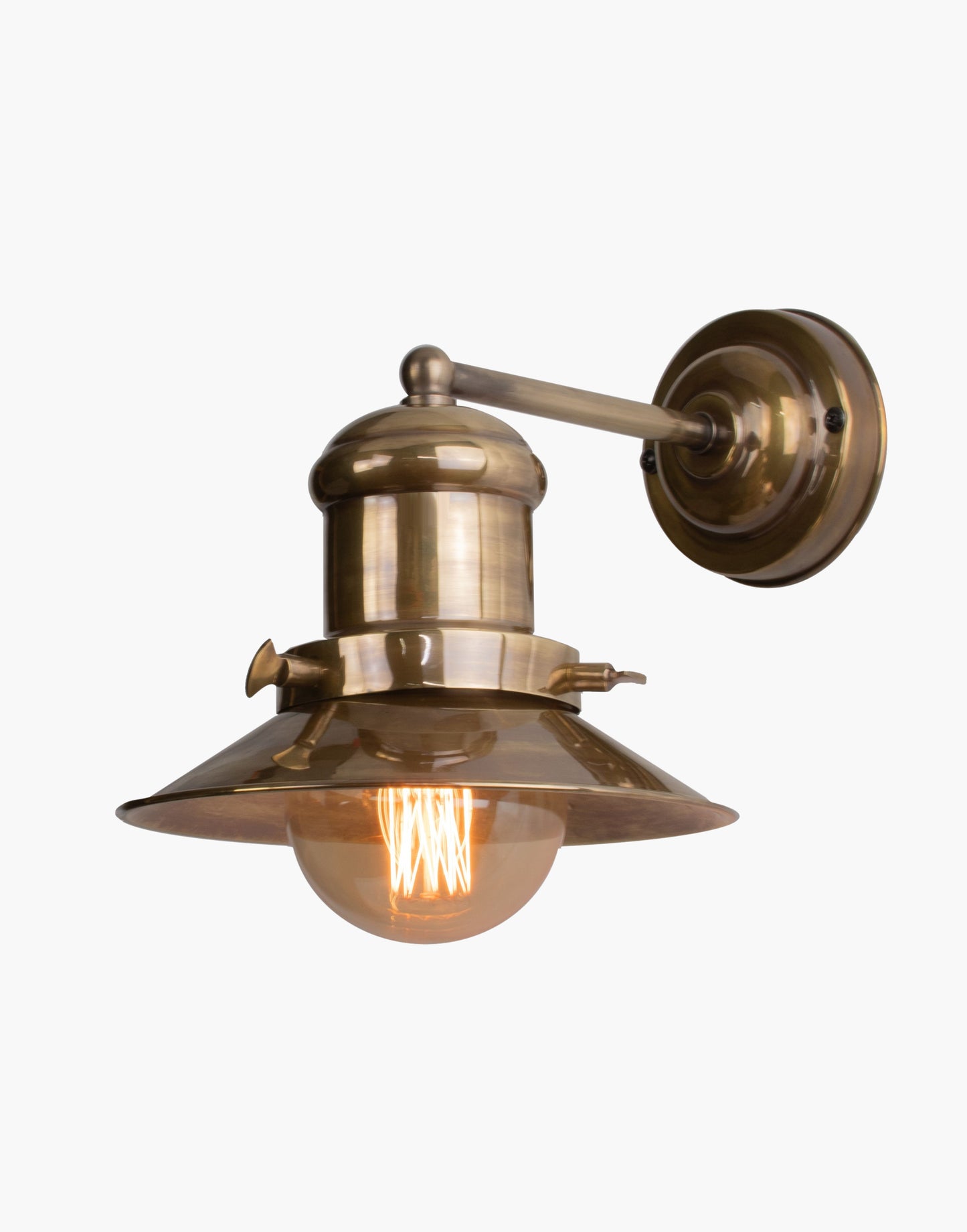 Single wall light in solid brass with Ferrowatt squirrel cage bulb, vintage-inspired wall sconce for exposed brick interiors.